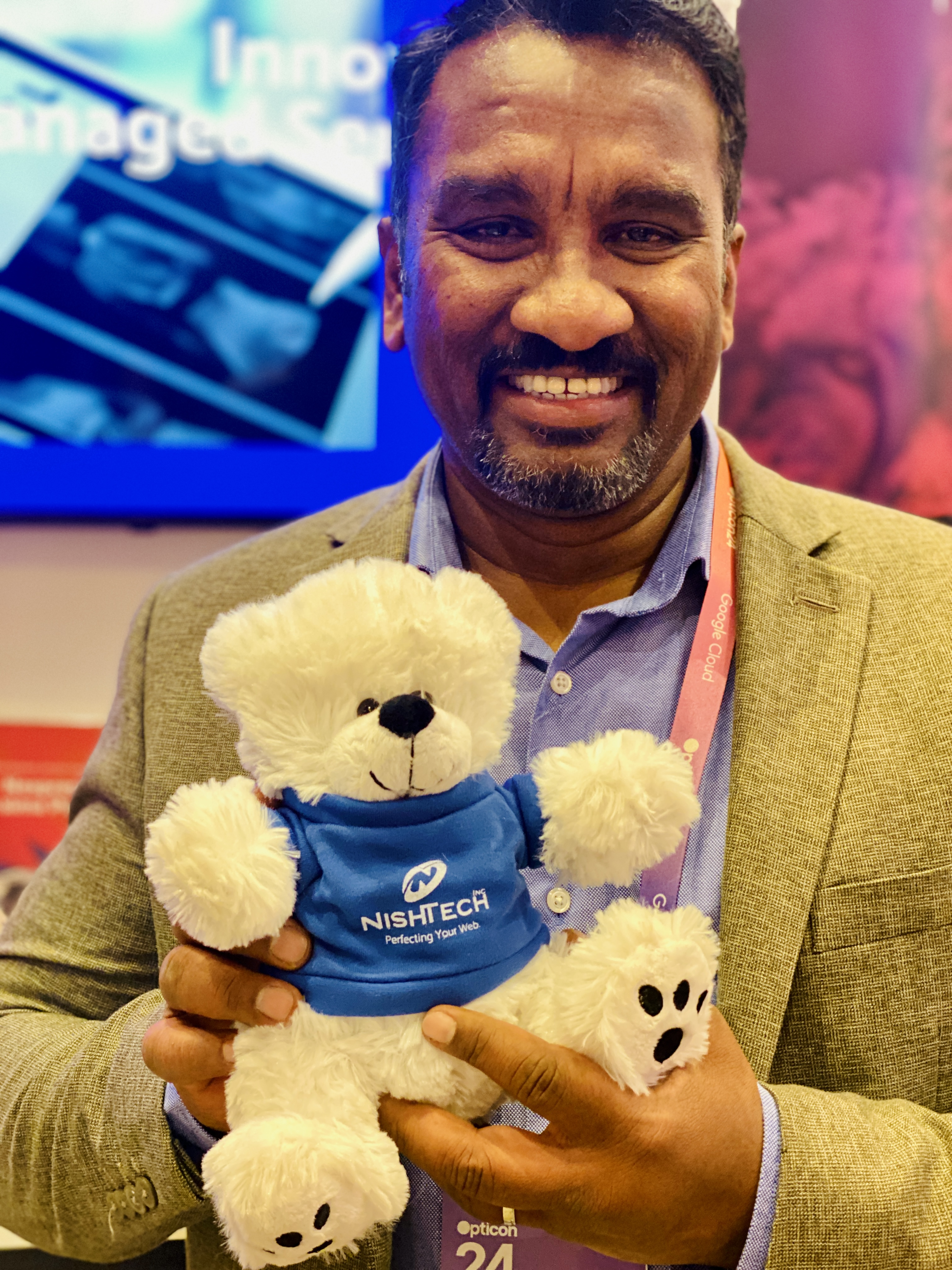 Suresh Devanan holding a Nishtech bear