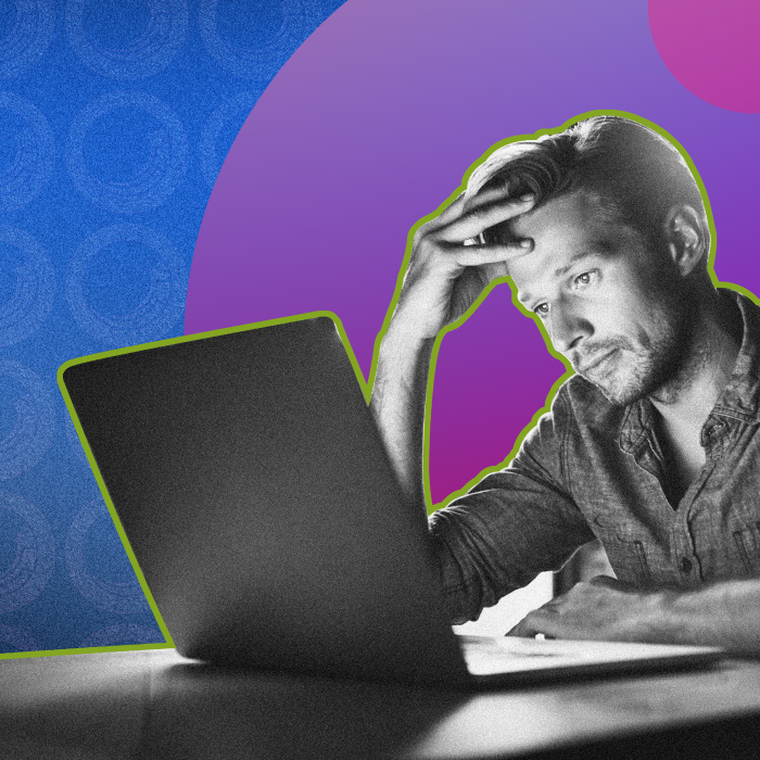 Frustrated Marketing Manager at computer